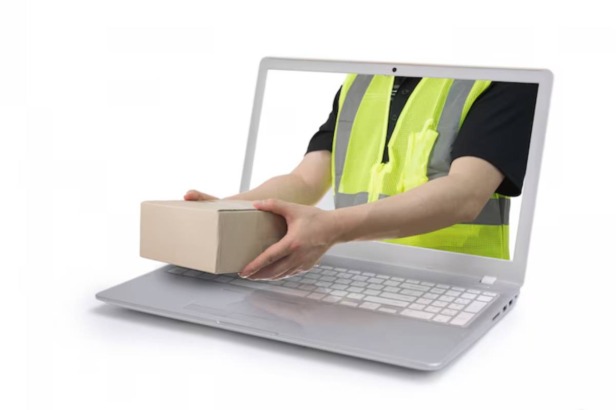 Dropshipping concept with a delivery man emerging from a laptop screen holding a parcel